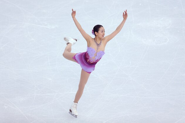 SOCHI, RUSSIA - FEBRUARY 08:  Mao Asada of Japan competes in the Figure Skating Team Ladies Short Program during day one of the Sochi 2014 Winter Olympics at Iceberg Skating Palace on February 8, 2014 in Sochi, Russia.  (Photo by Matthew Stockman/Getty Images)
