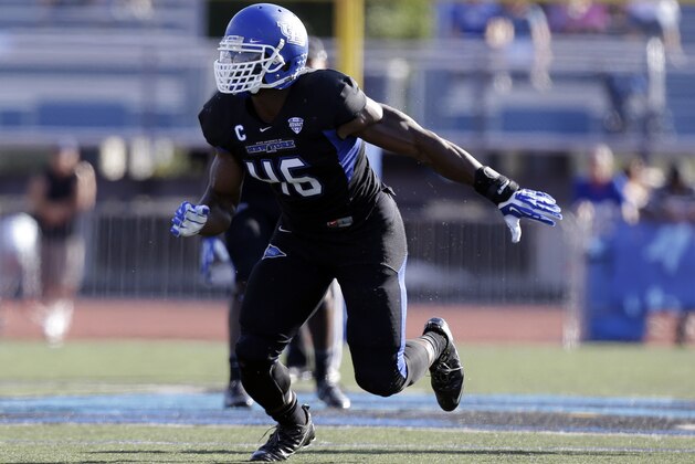 Buffalo linebacker Khalil Mack (46) runs on the field during the first half of an NCAA football game against the Connecticut on Saturday, Sept. 28, 2013, in Buffalo, N.Y. (AP Photo/Mike Groll)