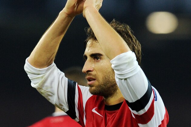 NAPLES, ITALY - DECEMBER 11:  Mathieu Flamini of Arsenal celebrates after the UEFA Champions League Group F match between SSC Napoli and Arsenal at Stadio San Paolo on December 11, 2013 in Naples, Italy.  (Photo by Giuseppe Bellini/Getty Images)