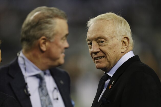 Dallas Cowboys owner Jerry Jones, left, talks with his son Stephen Jones, the team's executive vice president, before an NFL football game, Sunday, Dec. 29, 2013, in Arlington, Texas.  (AP Photo/Tim Sharp)