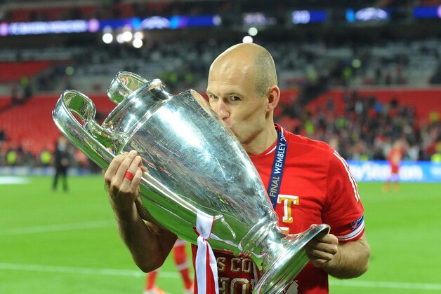 May 25, 2013; London, UNITED KINGDOM; Bayern Munich player Arjen Robben celebrates with the trophy after the Champions League final against Borussia Dortmund at Wembley Stadium.  Bayern Munich won 2-1. Mandatory Credit: Tim Groothuis/Witters Sport via USA TODAY Sports