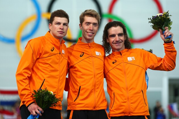 SOCHI, RUSSIA - FEBRUARY 18: (L-R) Silver medalist Sven Kramer of the Netherlands, gold medalist Jorrit Bergsma of the Netherlands and bronze medalist Bob de Jong of the Netherlands celebrate during the flower ceremony for the Men's 10000m Speed Skating event on day eleven of the Sochi 2014 Winter Olympics at Adler Arena Skating Center on February 18, 2014 in Sochi, Russia.  (Photo by Quinn Rooney/Getty Images)