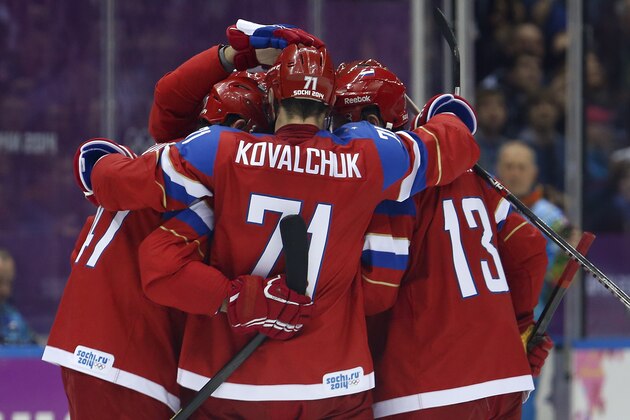 Team Russia celebrates a second period goal against Norway during a men's ice hockey game at the 2014 Winter Olympics, Tuesday, Feb. 18, 2014, in Sochi, Russia. (AP Photo/Mark Humphrey)