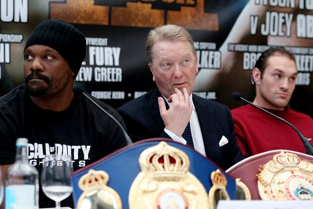 LONDON, ENGLAND - FEBRUARY 13:  Boxing promotor Frank Warren sits between Tyson Fury and Dereck Chisora during a press conference on February 13, 2014 in London, England.  (Photo by Scott Heavey/Getty Images)