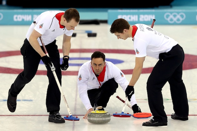 SOCHI, RUSSIA - FEBRUARY 18:  Michael Goodfellow and Scott Andrews of Great Britain sweep the ice in front of David Murdoch while playing Norway during the Curling at Ice Cube Curling Center on day 11 of the 2014 Sochi Winter Olympics on February 18, 2014 in Sochi, Russia.  (Photo by Matthew Stockman/Getty Images)
