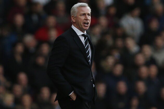 Newcastle United's manager Alan Pardew calls out to his players as he watches his team play against West Ham United, during their English Premier League soccer match at Upton Park, London, Saturday, Jan. 18, 2014. (AP Photo/Sang Tan)