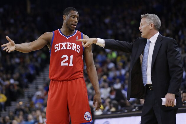 Philadelphia 76ers head coach Brett Brown, right, talks to Thaddeus Young (21) during an NBA basketball game against the Golden State Warriors on Monday, Feb. 10, 2014, in Oakland, Calif. (AP Photo/Marcio Jose Sanchez)