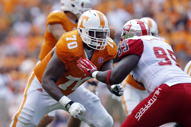 Tennessee offensive lineman Ja'Wuan James (70) blocks Western Kentucky defensive lineman Raphael Cox (95) during an NCAA college football game on Saturday, Sept. 7, 2013 in Knoxville, Tenn. (AP Photo/Wade Payne)