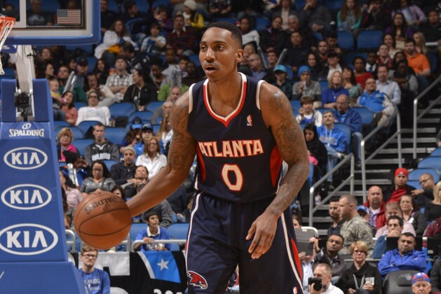 ORLANDO, FL - JANUARY 22: Jeff Teague #0 of the Atlanta Hawks dribbles up the court against the Orlando Magic during the game on January 22, 2014 at Amway Center in Orlando, Florida. NOTE TO USER: User expressly acknowledges and agrees that, by downloading and or using this photograph, User is consenting to the terms and conditions of the Getty Images License Agreement. Mandatory Copyright Notice: Copyright 2014 NBAE  (Photo by Fernando Medina/NBAE via Getty Images)