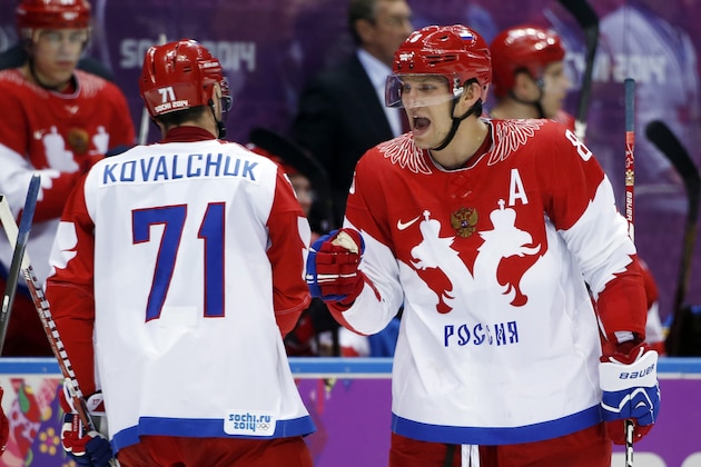 Russia forward Alexander Ovechkin greets forward Ilya Kovalchuk after a third period goal by forward Pavel Datsyuk against the USA during a men's ice hockey game at the 2014 Winter Olympics, Saturday, Feb. 15, 2014, in Sochi, Russia. (AP Photo/Julio Cortez)