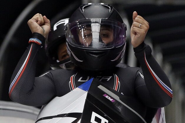 The team from the United States USA-1, piloted by Elana Meyers with brakeman Lauryn Williams, brake in the finish area after their second run during the women's two-man bobsled competition at the 2014 Winter Olympics, Tuesday, Feb. 18, 2014, in Krasnaya Polyana, Russia. (AP Photo/Dita Alangkara)