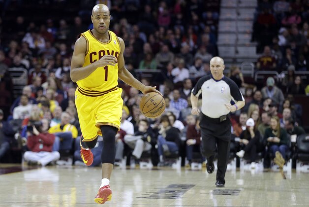 Cleveland Cavaliers' Jarrett Jack brings the ball up against the Phoenix Suns in an NBA basketball game Sunday, Jan. 26, 2014, in Cleveland. (AP Photo/Mark Duncan)