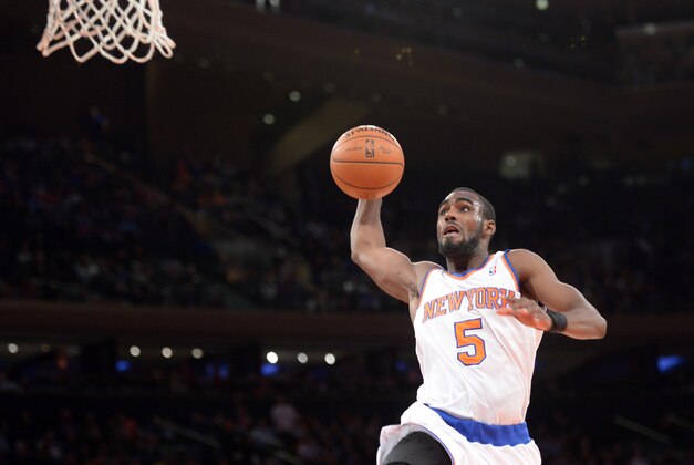Feb 7, 2014; New York, NY, USA; New York Knicks shooting guard Tim Hardaway Jr. (5) dunks against the Denver Nuggets during the second half at Madison Square Garden. The New York Knicks won the game 117-90. Mandatory Credit: Joe Camporeale-USA TODAY Sports