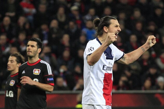 PSG's Zlatan Ibrahimovic, right celebrates after scoring during a Champions League round of the last 16 first leg soccer match between Bayer Leverkusen and Paris Saint-Germain in Leverkusen, Germany, Tuesday Feb. 18, 2014. (AP Photo/Frank Augstein)