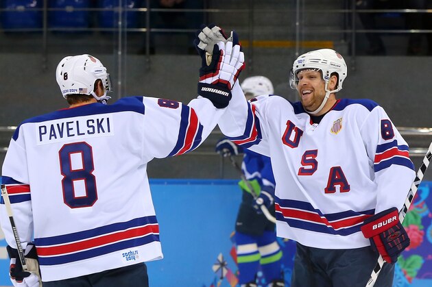 SOCHI, RUSSIA - FEBRUARY 16: Phil Kessel #81 of the United States celebrates with Joe Pavelski #8 of the United States after scoring his second goal in the first period against Slovenia, both assisted by Pavelski, during the Men's Ice Hockey Preliminary Round Group A game on day nine of the Sochi 2014 Winter Olympics at Shayba Arena on February 16, 2014 in Sochi, Russia.  (Photo by Martin Rose/Getty Images)