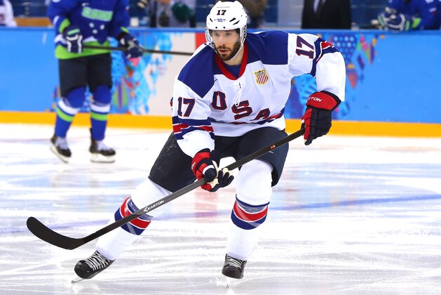 SOCHI, RUSSIA - FEBRUARY 16: Ryan Kesler #17 of the United States handles the puck in the third period against Slovenia during the Men's Ice Hockey Preliminary Round Group A game on day nine of the Sochi 2014 Winter Olympics at Shayba Arena on February 16, 2014 in Sochi, Russia.  (Photo by Martin Rose/Getty Images)