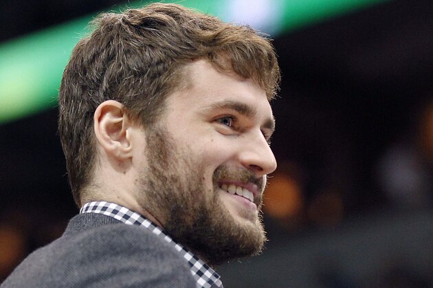 Minnesota Timberwolves forward Kevin Love smiles as he did not play in the game against the Portland Trail Blazers on Saturday, February 8, 2014 in Minneapolis.(AP Photo/Andy Clayton-King)