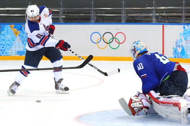 SOCHI, RUSSIA - FEBRUARY 16: Phil Kessel #81 of the United States shoots against Luka Gracnar #40 of Slovenia in the third period during the Men's Ice Hockey Preliminary Round Group A game on day nine of the Sochi 2014 Winter Olympics at Shayba Arena on February 16, 2014 in Sochi, Russia.  (Photo by Martin Rose/Getty Images)