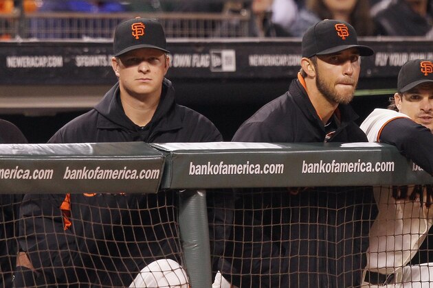 SAN FRANCISCO, CA - SEPTEMBER 04: Matt Cain #18 of the San Francisco Giants (left) and Madison Bumgarner #40 of the San Francisco Giants watch the game against the Arizona Diamondbacks from the dugout at AT&T Park on September 4, 2012 in San Francisco, California.  (Photo by Tony Medina/Getty Images)