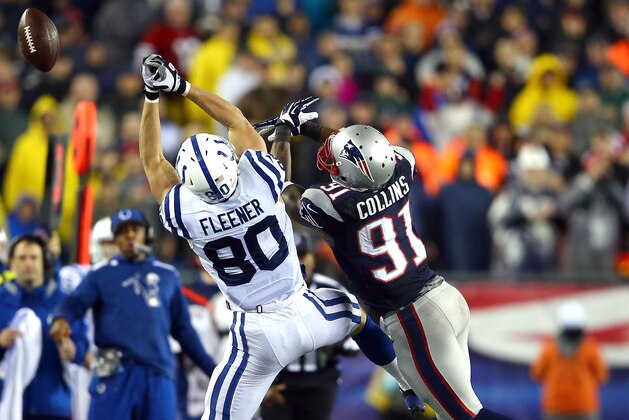 FOXBORO, MA - JANUARY 11:   Coby Fleener #80 of the Indianapolis Colts misses a cathc against  Jamie Collins #91 of the New England Patriots during the AFC Divisional Playoff game at Gillette Stadium on January 11, 2014 in Foxboro, Massachusetts.  (Photo by Al Bello/Getty Images)