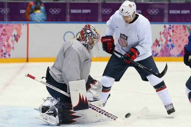 SOCHI, RUSSIA - FEBRUARY 10: Goaltender Jimmy Howard #35 makes the stop on Zach Parise #9 during a Team USA practice on day three of the Sochi 2014 Winter Olympics at Bolshoy Arena on February 10, 2014 in Sochi, Russia.  (Photo by Bruce Bennett/Getty Images)