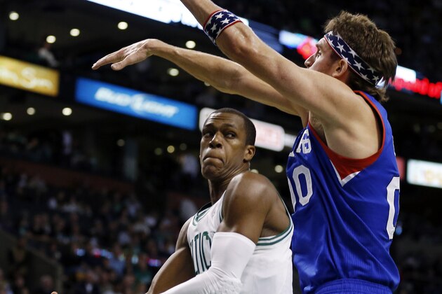Boston Celtics' Rajon Rondo, left, moves against Philadelphia 76ers' Spencer Hawes during the second quarter of an NBA basketball game in Boston, Friday, Nov. 9, 2012. (AP Photo/Michael Dwyer)