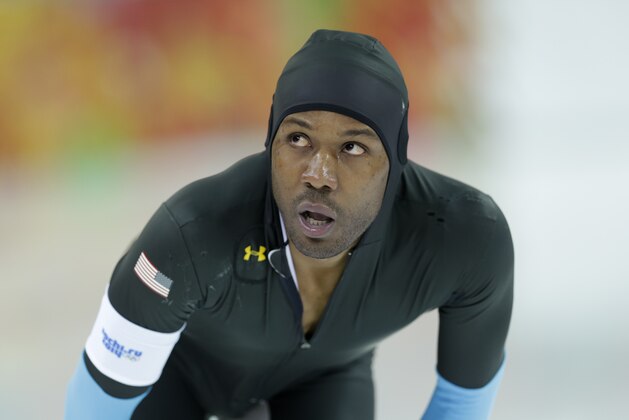 Shani Davis of the U.S. looks at the scoreboard after racing in the men's 1,500-meter speedskating at the Adler Arena Skating Center during the 2014 Winter Olympics in Sochi, Russia, Saturday, Feb. 15, 2014. (AP Photo/Patrick Semansky)