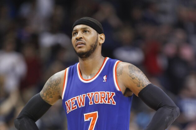 New York Knicks forward Carmelo Anthony (7) shows his disappointment in the closing seconds of an NBA basketball game against the Memphis Grizzlies, Tuesday, Feb. 18, 2014, in Memphis, Tenn. The Grizzlies won 98-93. (AP Photo/Lance Murphey)