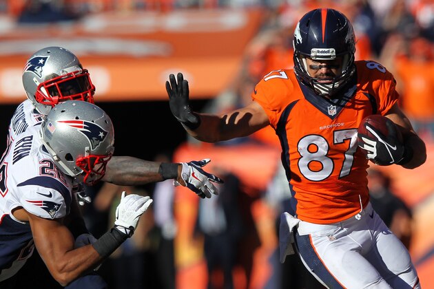 DENVER, CO - JANUARY 19:  Eric Decker #87 of the Denver Broncos tries to avod the tackle of  Logan Ryan #26 of the New England Patriots in the third quarter during the AFC Championship game at Sports Authority Field at Mile High on January 19, 2014 in Denver, Colorado.  (Photo by Jamie Squire/Getty Images)
