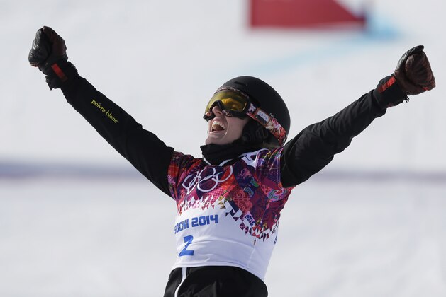 Switzerland's Patrizia Kummer wins her  women's snowboard parallel giant slalom semifinal at the Rosa Khutor Extreme Park, at the 2014 Winter Olympics, Wednesday, Feb. 19, 2014, in Krasnaya Polyana, Russia. (AP Photo/Andy Wong)