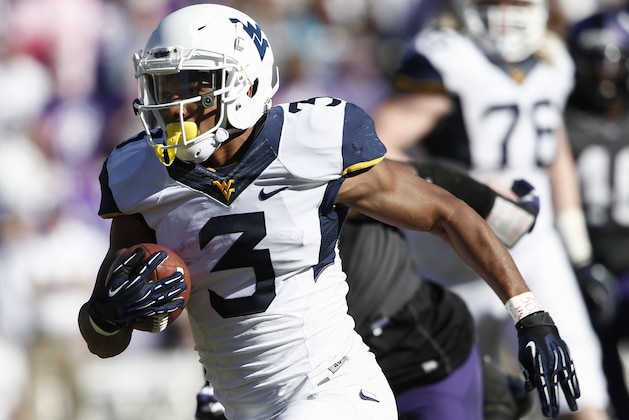 West Virginia running back Charles Sims (3) runs for a touchdown during the first half of an NCAA football game, Saturday, Nov. 2, 2013, in Fort Worth, Texas. (AP Photo/Jim Cowsert)