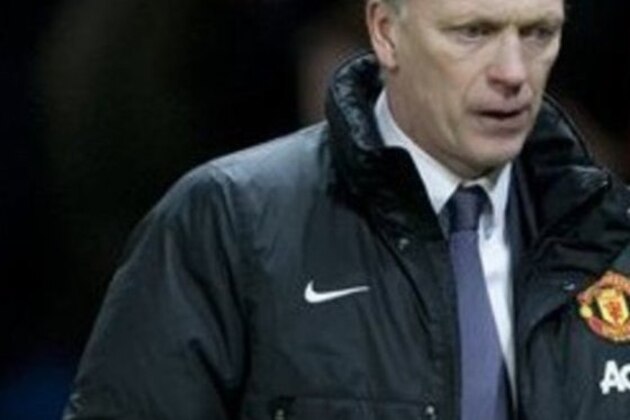 Manchester United's manager David Moyes walks from the pitch after his team's 2-2 draw against Fulham in their English Premier League soccer match at Old Trafford Stadium, Manchester, England, Sunday Feb. 9, 2014. (AP Photo/Jon Super)