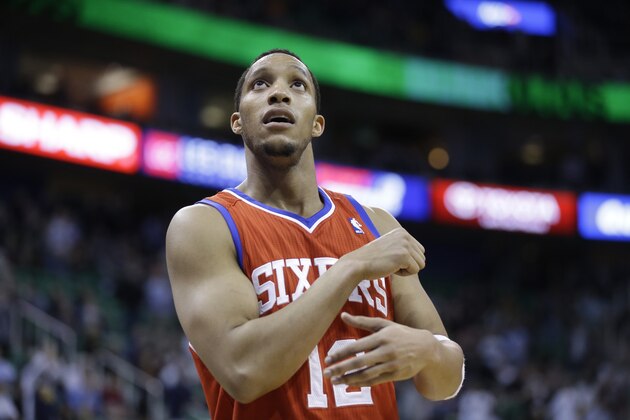 Philadelphia 76ers' Evan Turner (12) looks at the scoreboard in the second half of an NBA basketball game against the Utah Jazz Wednesday, Feb. 12, 2014, in Salt Lake City. (AP Photo/Rick Bowmer)