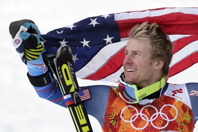 Men's giant slalom gold medalist Ted Ligety of the United States poses for photographers with the American flag on the podium at the Sochi 2014 Winter Olympics, Wednesday, Feb. 19, 2014, in Krasnaya Polyana, Russia.(AP Photo/Charles Krupa) Men's giant slalom gold medalist Ted Ligety of the United States poses for photographers with the American flag on the podium at the Sochi 2014 Winter Olympics, Wednesday, Feb. 19, 2014, in Krasnaya Polyana, Russia.(AP Photo/Charles Krupa)