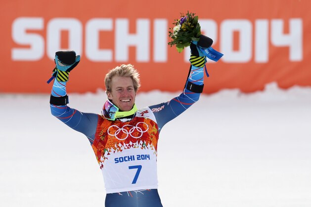 Men's giant slalom gold medalist Ted Ligety of the United States stands on the podium during a flower ceremony at the Sochi 2014 Winter Olympics, Wednesday, Feb. 19, 2014, in Krasnaya Polyana, Russia. (AP Photo/Gero Breloer)