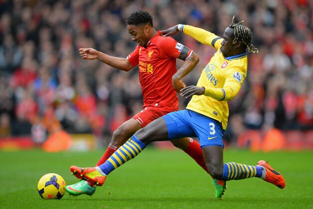 LIVERPOOL, ENGLAND - FEBRUARY 08:  Raheem Sterling of Liverpool is challenged by Bacary Sagna of Arsenal during the Barclays Premier League match between Liverpool and Arsenal at Anfield on February 8, 2014 in Liverpool, England.  (Photo by Michael Regan/Getty Images)