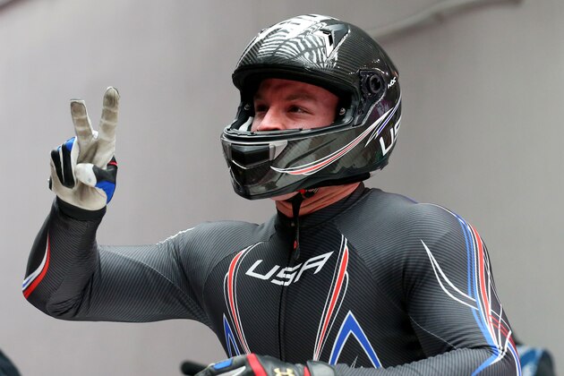 SOCHI, RUSSIA - FEBRUARY 17:  Dallas Robinson of the United States team 3 celebrates during the Men's Two-Man Bobsleigh on Day 10 of the Sochi 2014 Winter Olympics at Sliding Center Sanki on February 17, 2014 in Sochi, Russia.  (Photo by Alex Livesey/Getty Images)