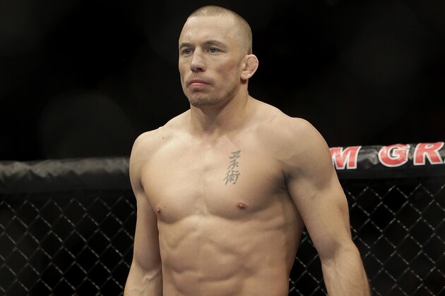 Georges St. Pierre, of Canada, waits to begin a UFC 167 mixed martial arts championship welterweight bout against Johny Hendricks on Saturday, Nov. 16, 2013, in Las Vegas. St. Pierre won by split decision. (AP Photo/Isaac Brekken) Georges St. Pierre, of Canada, waits to begin a UFC 167 mixed martial arts championship welterweight bout against Johny Hendricks on Saturday, Nov. 16, 2013, in Las Vegas. St. Pierre won by split decision. (AP Photo/Isaac Brekken)