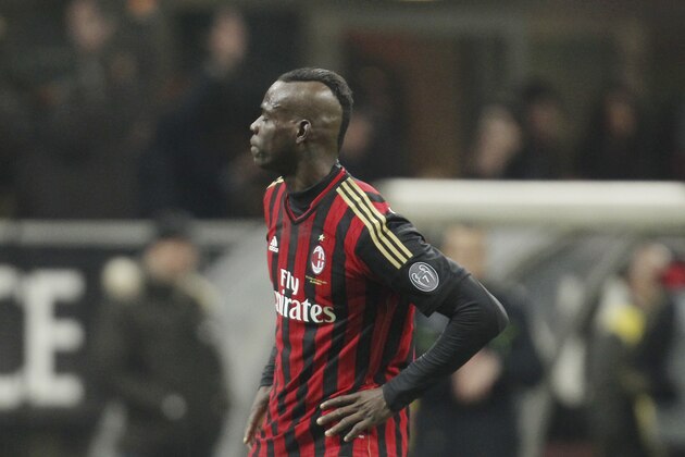 AC Milan forward Mario Balotelli celebrates after scoring during the Serie A soccer match between AC Milan and Bologna at the San Siro stadium in Milan, Italy, Friday, Feb. 14, 2014. (AP Photo/Antonio Calanni)