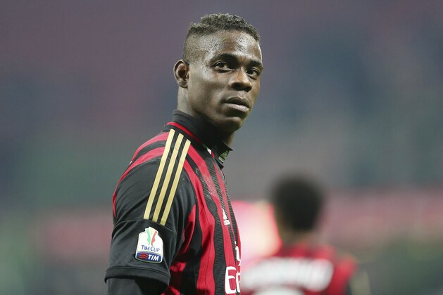 AC Milan forward Mario Balotelli stands during the Italian Cup soccer match between AC Milan and Udinese at the San Siro stadium in Milan, Italy, Wednesday, Jan. 22, 2014. (AP Photo/Antonio Calanni)