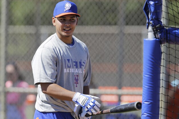 New York Mets infielder Ruben Tejada takes batting practice during spring training baseball Monday, Feb. 17, 2014, in Port St. Lucie, Fla. (AP Photo/Jeff Roberson)