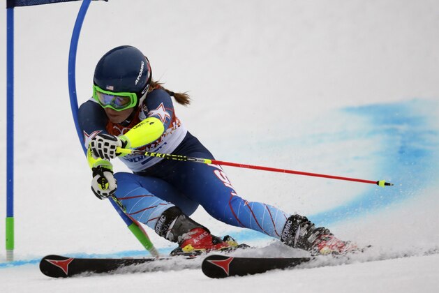 United States' Mikaela Shiffrin passes a gate in the first run of the women's giant slalom at the Sochi 2014 Winter Olympics, Tuesday, Feb. 18, 2014, in Krasnaya Polyana, Russia. (AP Photo/Charles Krupa)