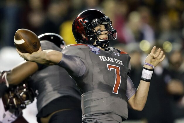 Texas Tech quarterback Davis Webb throws a long pass against Arizona State during the first half of the Holiday Bowl NCAA college football game, Monday, Dec. 30, 2013, in San Diego. Webb has thrown four touchdown passes in the first half.  (AP Photo/Lenny Ignelzi)