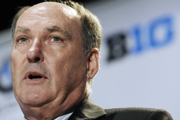 FILE - In this July 28, 2011, file photo, Big Ten Commissioner Jim Delany speaks to reporters during Big Ten media day in Chicago. The BCS commissioners, including Delany, are backing a playoff plan with the sites for the national semifinals rotating among the major bowl games and a selection committee picking the teams, Notre Dame Athletic Director Swarbrick said Wednesday, June 20, 2012. (AP Photo/Paul Beaty, File)