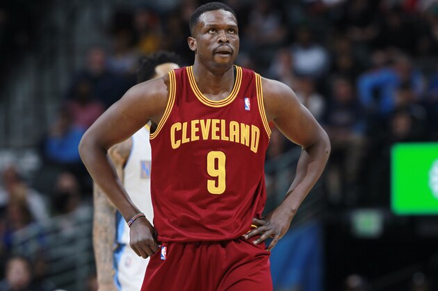 Cleveland Cavaliers forward Luol Deng, of Sudan, checks scoreboard while facing the Denver Nuggets in the third quarter of the Cavaliers' 117-109 victory in an NBA basketball game in Denver on Friday, Jan. 17, 2014. (AP Photo/David Zalubowski)