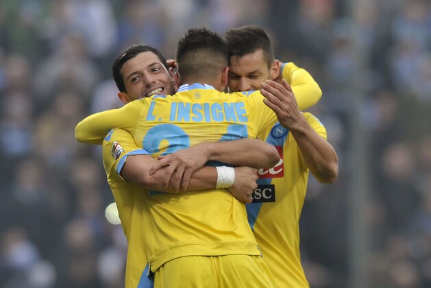 Napoli's Lorenzo Insigne, center, celebrates with his teammates Blerim Dzemaili of Switzerland, left, and Christian Maggio, after scoring against Sassuolo during their Italian Serie A soccer match at Mapei stadium in Reggio Emilia, Italy, Sunday, Feb. 16, 2014. (AP Photo/Marco Vasini)