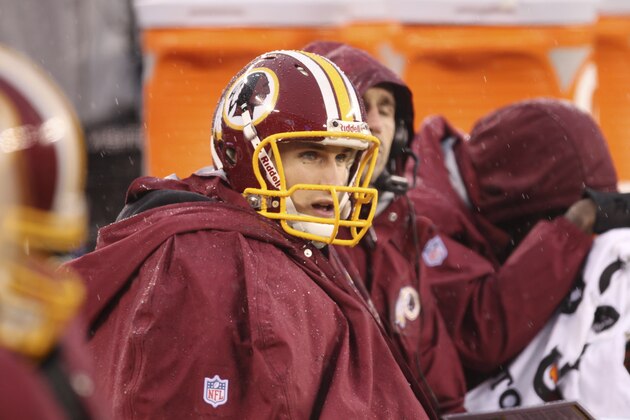 Washington Redskins quarterback Kirk Cousins (12) sits on the bench during the first half of an NFL football game against the New York Giants Sunday, Dec. 29, 2013, in East Rutherford, N.J.  (AP Photo/Peter Morgan)