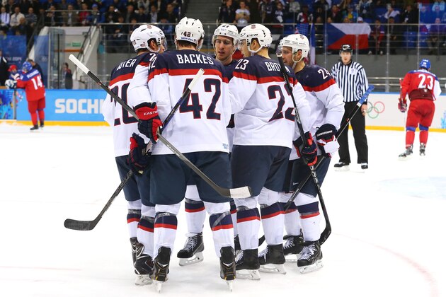SOCHI, RUSSIA - FEBRUARY 19:  David Backes #42 (2nd L) of the United States celebrates with teammates after scoring his team's third goal against Ondrej Pavelec #31 of the Czech Republic in the first period during the Men's Ice Hockey Quarterfinal Playoff on Day 12 of the 2014 Sochi Winter Olympics at Shayba Arena on February 19, 2014 in Sochi, Russia.  (Photo by Martin Rose/Getty Images)