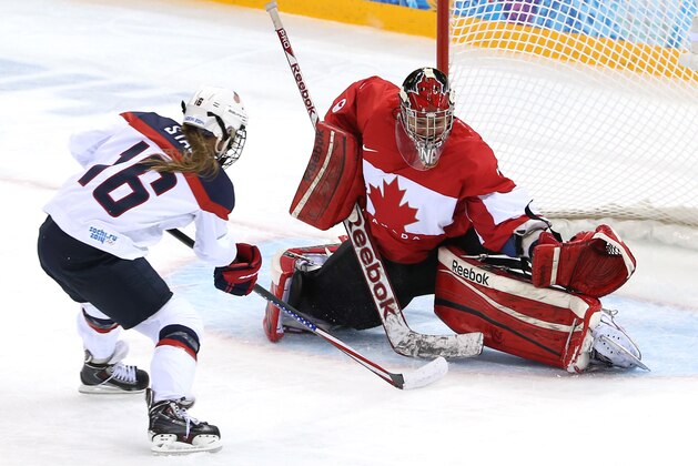 SOCHI, RUSSIA - FEBRUARY 12: Charline Labonte #32 of Canada makes a save against Kelli Stack #16 of the United States in the second period during the Women's Ice Hockey Preliminary Round Group A game on day five of the Sochi 2014 Winter Olympics at Shayba Arena on February 12, 2014 in Sochi, Russia.  (Photo by Bruce Bennett/Getty Images)