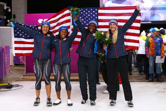 SOCHI, RUSSIA - FEBRUARY 19:  Silver medallists Elana Meyers (L) and Lauryn Williams (2ndL) of the United States team 1 pose with bronze medallists Jamie Greubel (R) and Aja Evans of the United States team 2 during the Women's Bobsleigh on Day 12 of the Sochi 2014 Winter Olympics at Sliding Center Sanki on February 19, 2014 in Sochi, Russia.  (Photo by Al Bello/Getty Images)